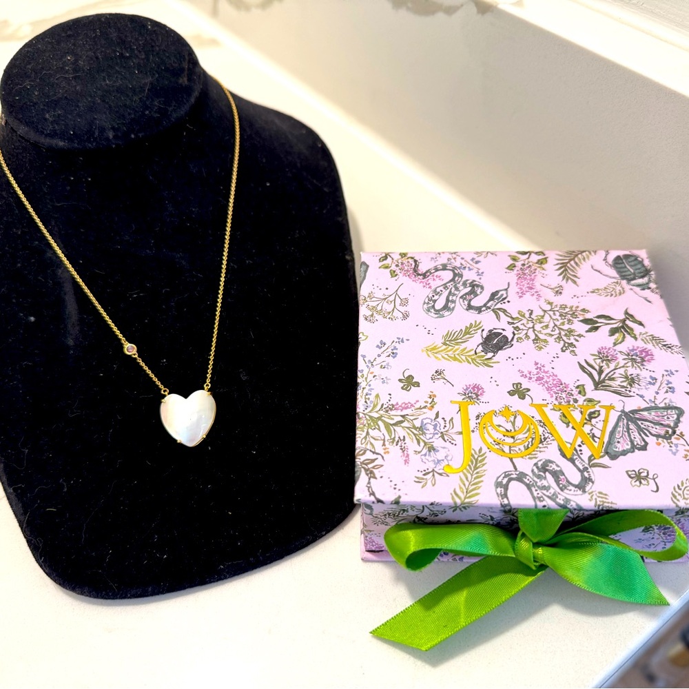 Jane Winchester LOVE carved heart necklace in 10k gold.